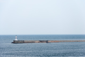 Lonely standing lighthouse among the open spaces.