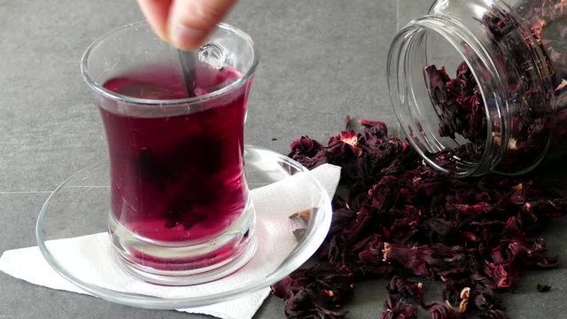 hibiscus flower tea prepared in a glass,