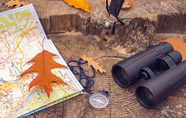 items for tourism laid out on a stump