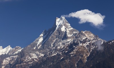 View of Machapuchare, Machhapuchchhre or Machhapuchhre Mountain Peak, also known as Fish Tail, in Nepal Himalayas on Annapurna Base Camp Hiking or Trekking Route