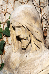 Fototapeta premium Historic Jesus on the mystery old Prague Cemetery, Czech Republic