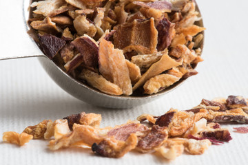 Dried Shallots Spilled from a Teaspoon