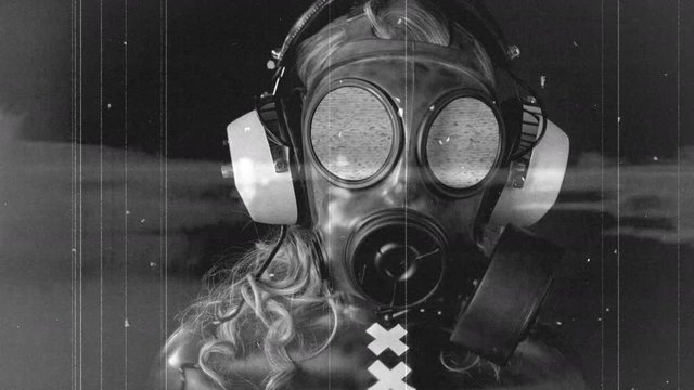 Woman wearing gas mask and speakers