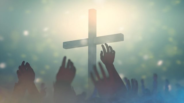  hands of a crowd of people at a Christian meeting during the praise of God against the background of the cross 3d render