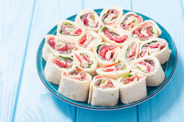 Sliced sandwich tortilla with vegetables and ham
