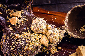 details of chocolate with peanuts, Brazilian and homemade Easter egg, focal point in macro image.