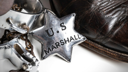 Western themed United States Marshall badge with cowboy boots and spurs