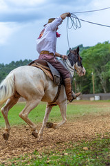 man riding a horse at a Creole rodeo 