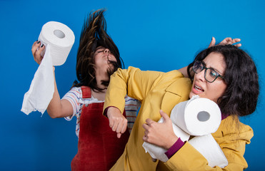 Women fighting for TP (toilet paper) amidst Coronavirus (Covid-19) pandemic; panic buying as...
