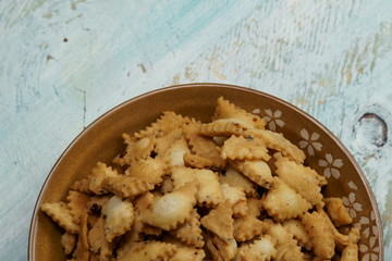 Namakpara (Khurma, Nimki, Mathri) which is a crispy, crunchy and savory strips in a bowl.