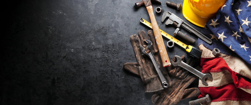 Construction and manufacturing tools with patriotic US, USA, American flag on dark black background - Powered by Adobe