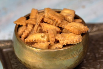 Namakpara (Khurma, Nimki, Mathri) which is a crispy, crunchy and savory strips in a bowl.