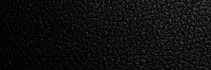 black paper texture or background with spotlight, dark tone 