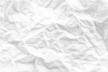white and gray crumpled paper texture background. crush paper so that it becomes creased and...