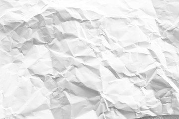 white and gray crumpled paper texture background. crush paper so that it becomes creased and wrinkled.