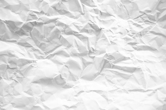 white and gray crumpled paper texture background. crush paper so that it becomes creased and wrinkled.