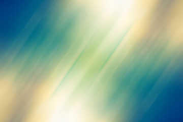 Obraz premium Abstract yellow and blue blurred background. Sandy beach backdrop with turquoise water and bright sun light. Summer holidays concept. Vintage style. Summer background