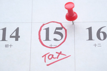 Tax day concept. The USA tax due date marked on the calendar