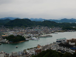 Fototapeta na wymiar View over cloudy coastal Japanese city