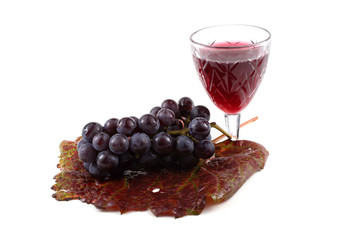 Grape and wine on autumn leaf