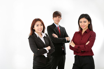 Young attractive one man two woman business office white background stand pose confident look at camera smile