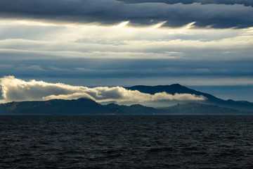 Fototapeta na wymiar Angel Island, Mt Tamalpais, fog and clouds.