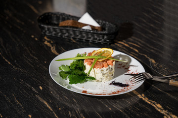 salad with fresh vegetables and salmon, a beautiful presentation of the dish