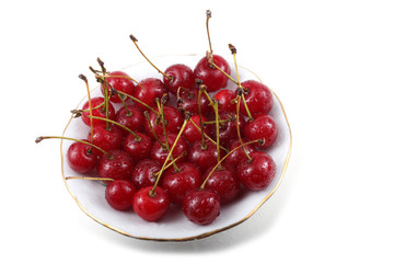 Red cherries on dish