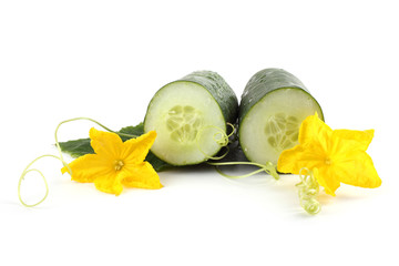 Cucumber halves, leaves and flowers