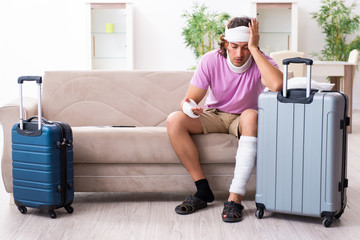 Young injured man preparing for the trip