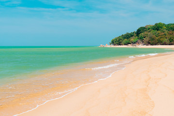 Tropical nature clean beach and white sand in summer with sun light blue sky and bokeh background.
