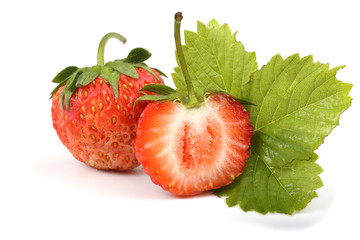 Strawberry with a half and leaf