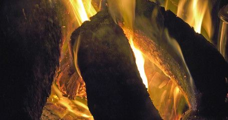 Sticks Blocks firewood and Peat Turf burning in open fire from a Bog in Ireland