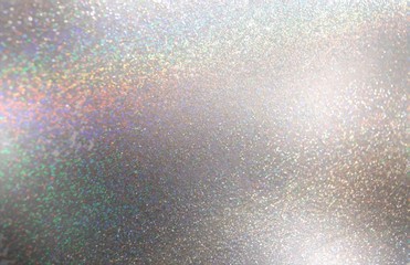 Shimmer silver texture decorated spectrum flare. Abstract pattern. Iridescent glitter metal background.