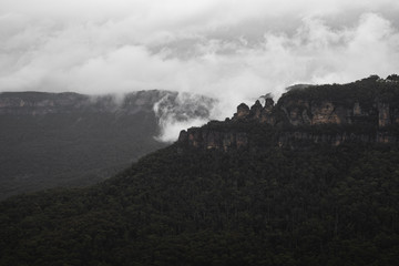 The view of the Three Sisters as seen from Sublime Point Lookout on a moody rainy day.