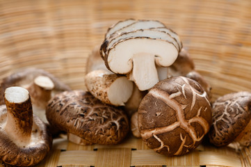 Obraz na płótnie Canvas Shiitake mushrooms on the wooden background.