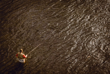 Fly fisherman fishing for stealhead trout on the Rogue River in Southern Oregon