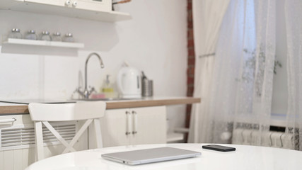 Young Woman Coming and Sitting to Use Laptop