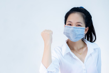 women wear masks ,Ready to use your hand to make a symbol to fight the virus.Corona virus, or Covid-19, is spreading all over the world.
