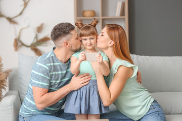 Family taking selfie at home