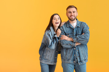 Fototapeta premium Happy friends on color background