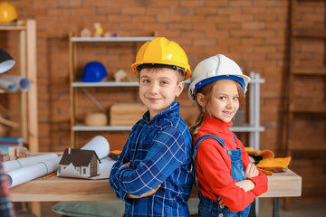 Cute little architects in office