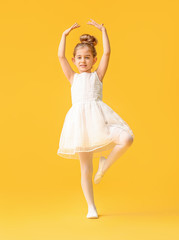 Cute little ballerina on color background © Pixel-Shot