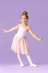 Fototapeta na wymiar Cute little ballerina on color background
