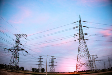 High voltage power cord. Sub-station. High voltage transmission tower. A distribution substation with power lines and transformers.