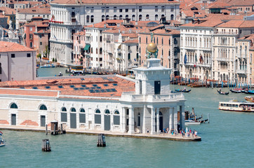 The Giudecca and Grand Canals meet in Venice near the Santa Maria della Salute church and the St Mark's Basilica.