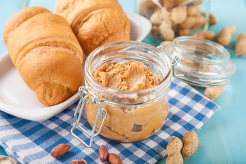 peanut paste and croissants on a table, selective focus