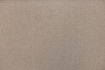 Fine texture of wicker brown burlap fabric. Soft focus.