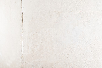 concrete gray wall with cracked, place for inscription on the right