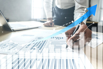 Double Exposure Image of Business and Finance - Businessman with report chart up forward to financial profit growth of stock market investment.